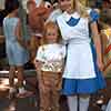 Disneyland Magic Kingdom Club guest with Alice in Town Square, June 2, 1968