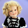 Danbury Mint Shirley Temple doll by Elke Hutchens wearing 1982 Ideal Heidi dress