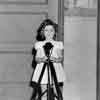 Shirley Temple in front of the Fox Studio Cafe de Paris, April 1935