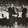 Nelson Eddy, Shirley Temple, and Bob Mitchell, leader of St. Brendan's Boys' Choir, Screen Guild Gulf Oil radio broadcast of the Blue Bird, December 24, 1939