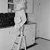 Shirley Temple dropping dishes at home, 1937