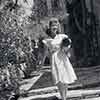 Shirley Temple at home with her dog Ching Ching, 1943